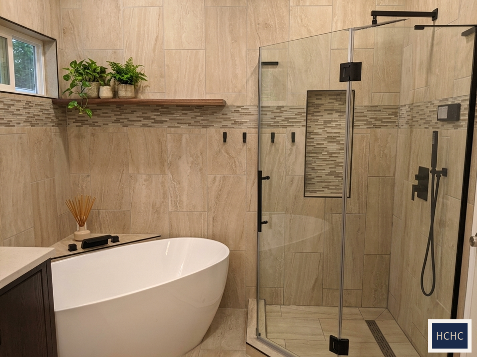Modern bathroom with freestanding tub and glass shower in Texas Hill Country home